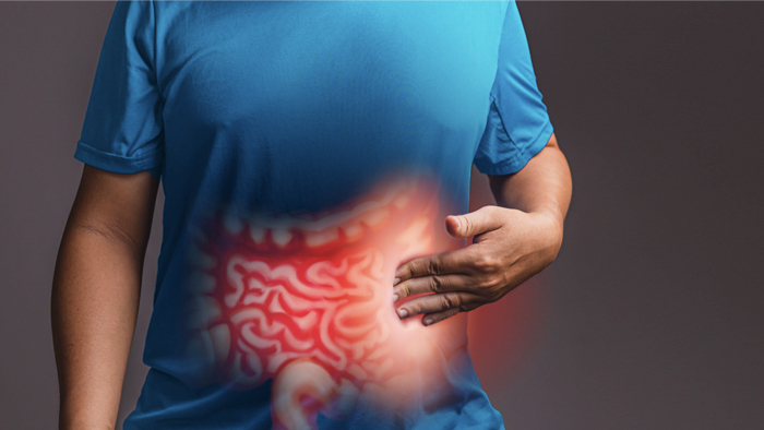 Image of man touching torso that shows illustration of a colon