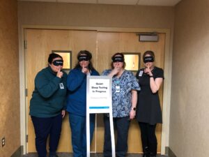 Sleep Center team wearing sleep masks